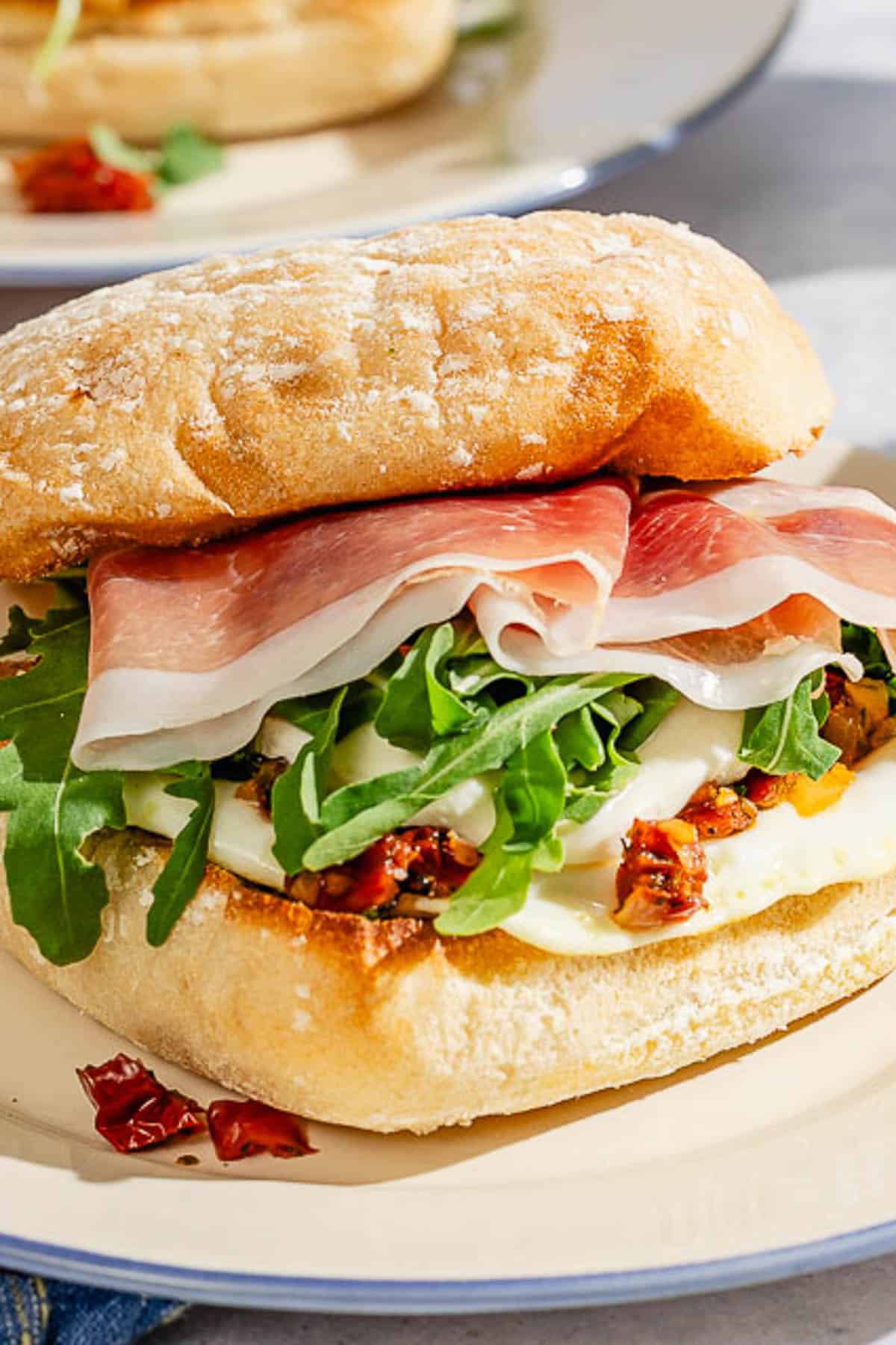 A close up of a breakfast sandwich on a plate.