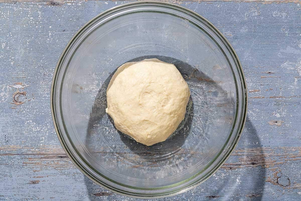 The dough for the pissaladière in a bowl.