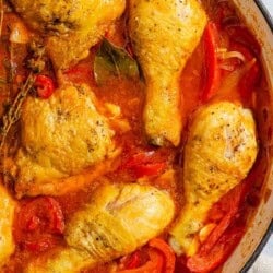 Chicken and peppers in a skillet.