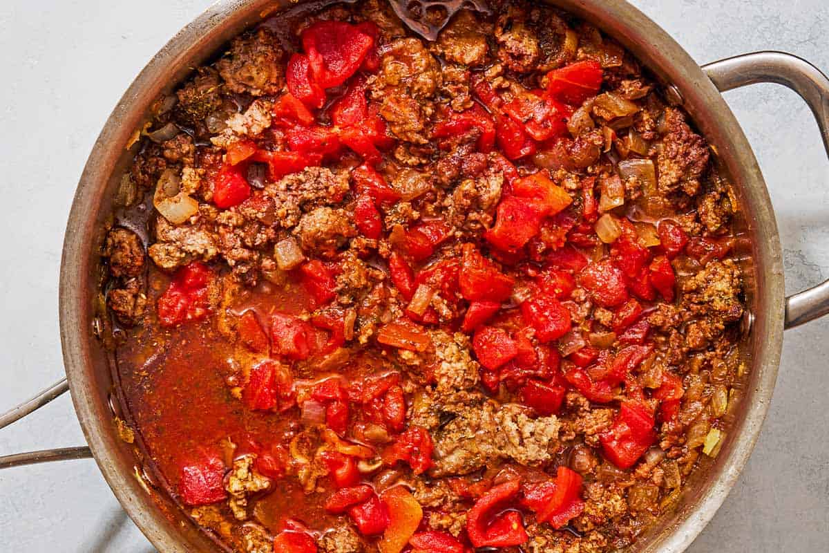 The meat sauce for the moussaka in a skillet.