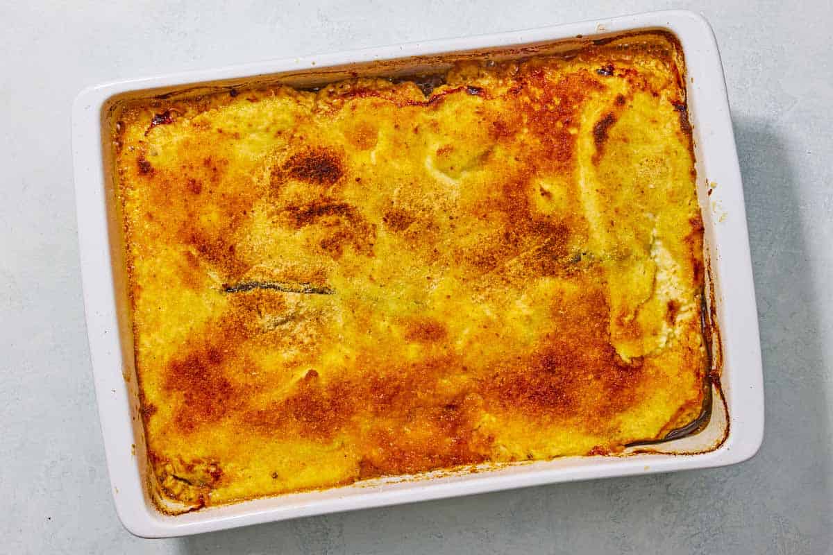 An overhead photo of moussaka in a baking dish.