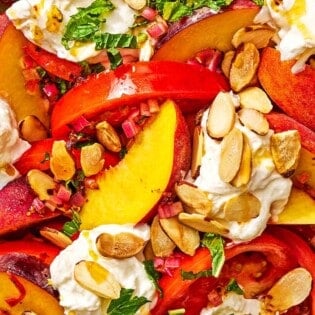 A close up of the peach burrata salad.