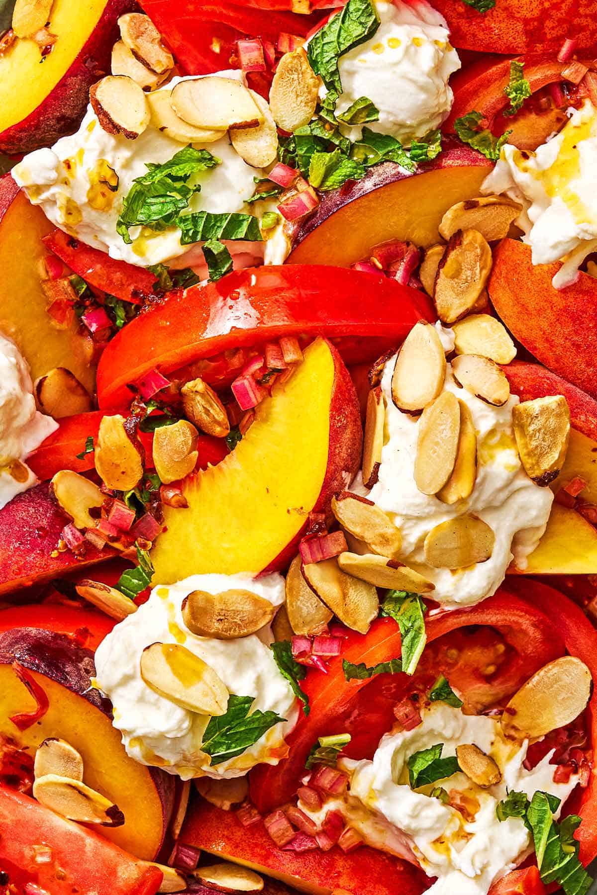 A close up of the peach burrata salad.