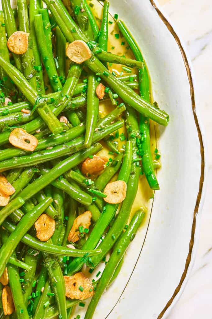 A close up of italian green bean salad in a bowl.