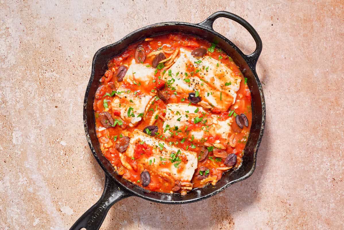 Provençal fish in a cast iron skillet.