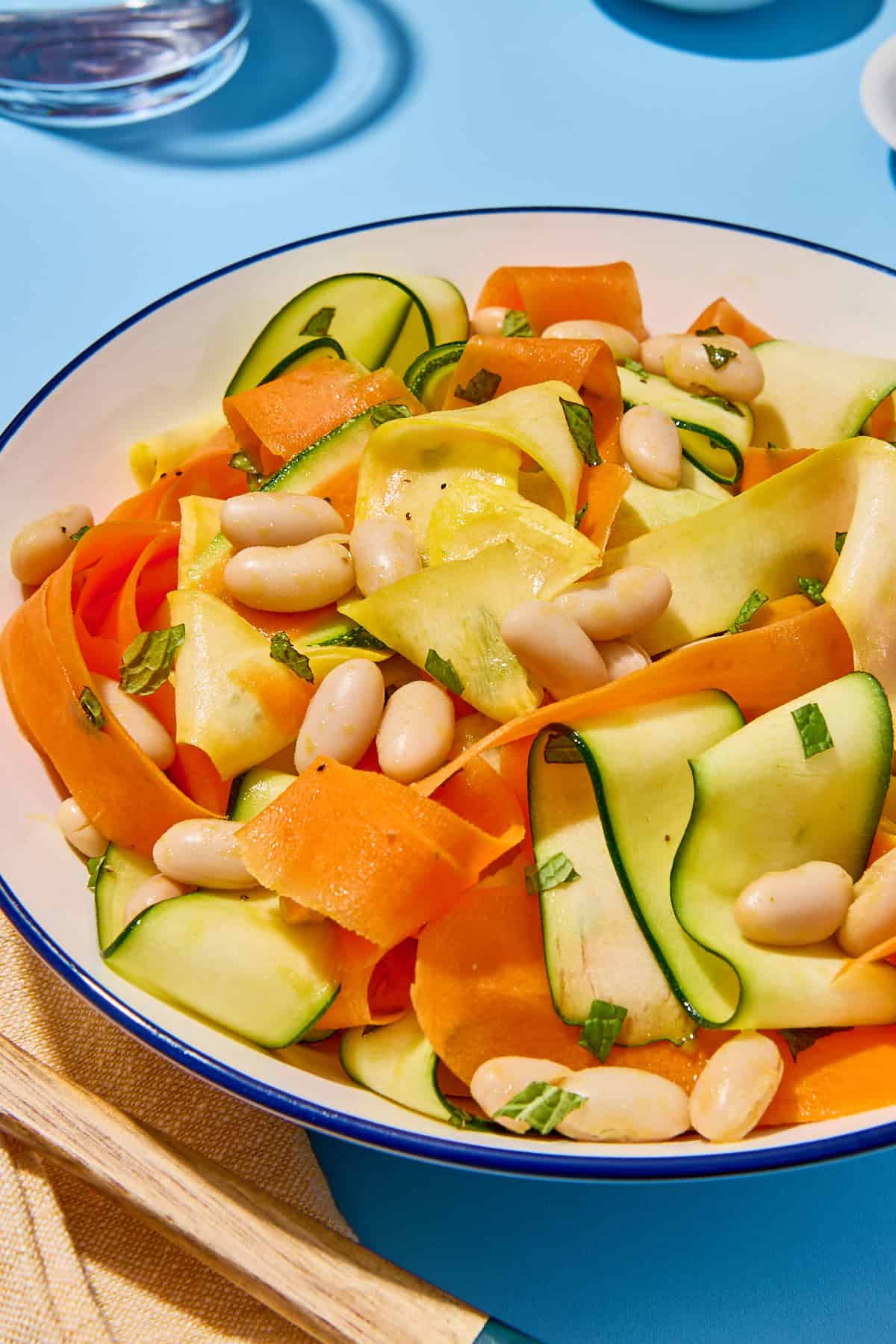 A close up of zucchini ribbon salad in a bowl.