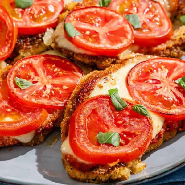 A close up of the pieces of baked cauliflower parmesan on a platter.