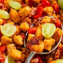 A close up of migas with a spoon.