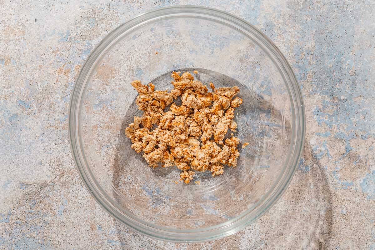 The crumbled pieces of whole wheat bread in a bowl.