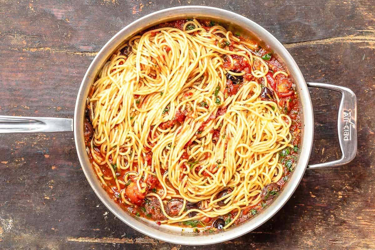 The puttanesca recipe in a tall sided skillet.