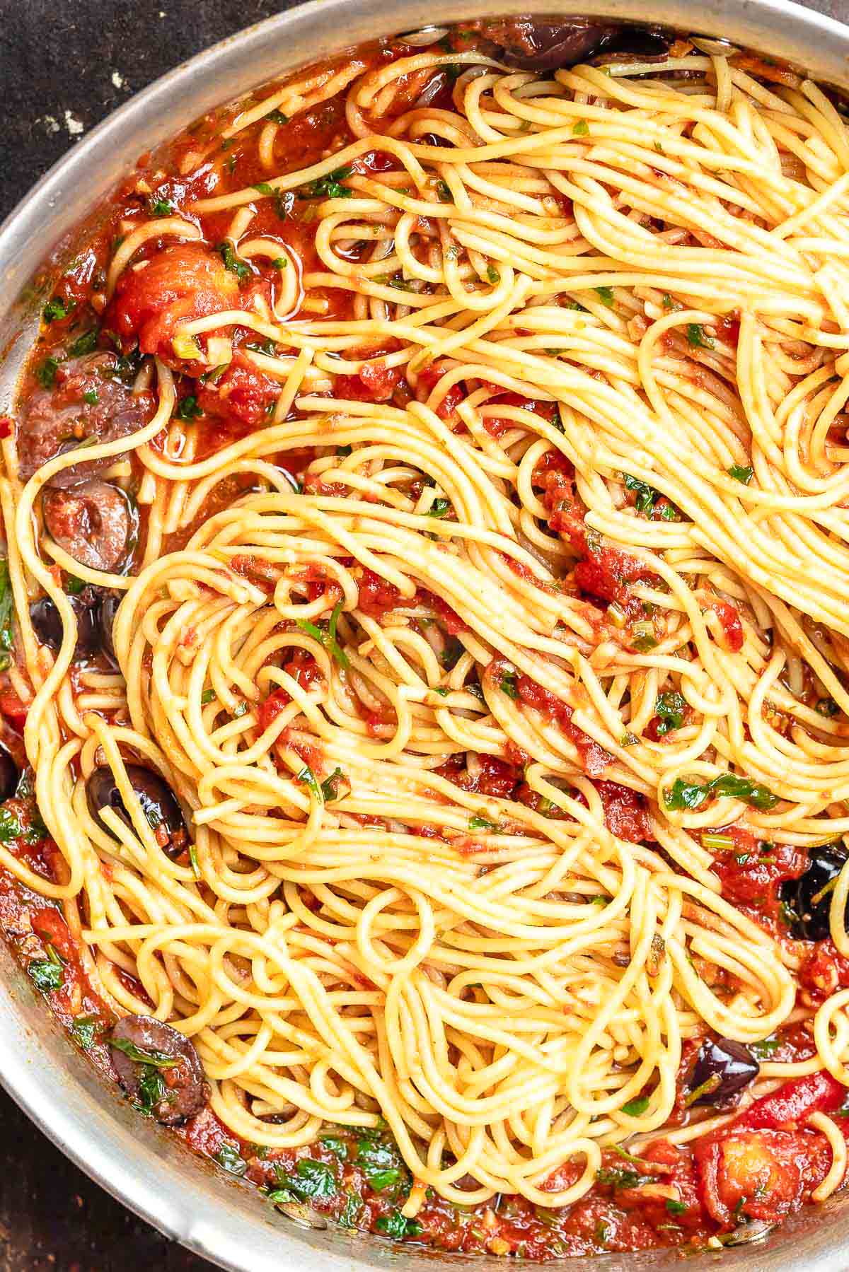 The puttanesca recipe in a tall sided skillet.