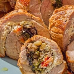 A close up of several slices of the stuffed pork tenderloin.
