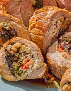 A close up of several slices of the stuffed pork tenderloin.