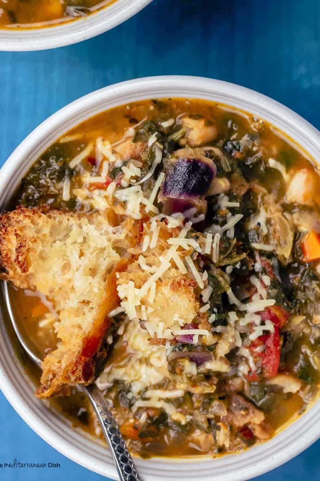 Ribollita served with a garnish of Paremsan