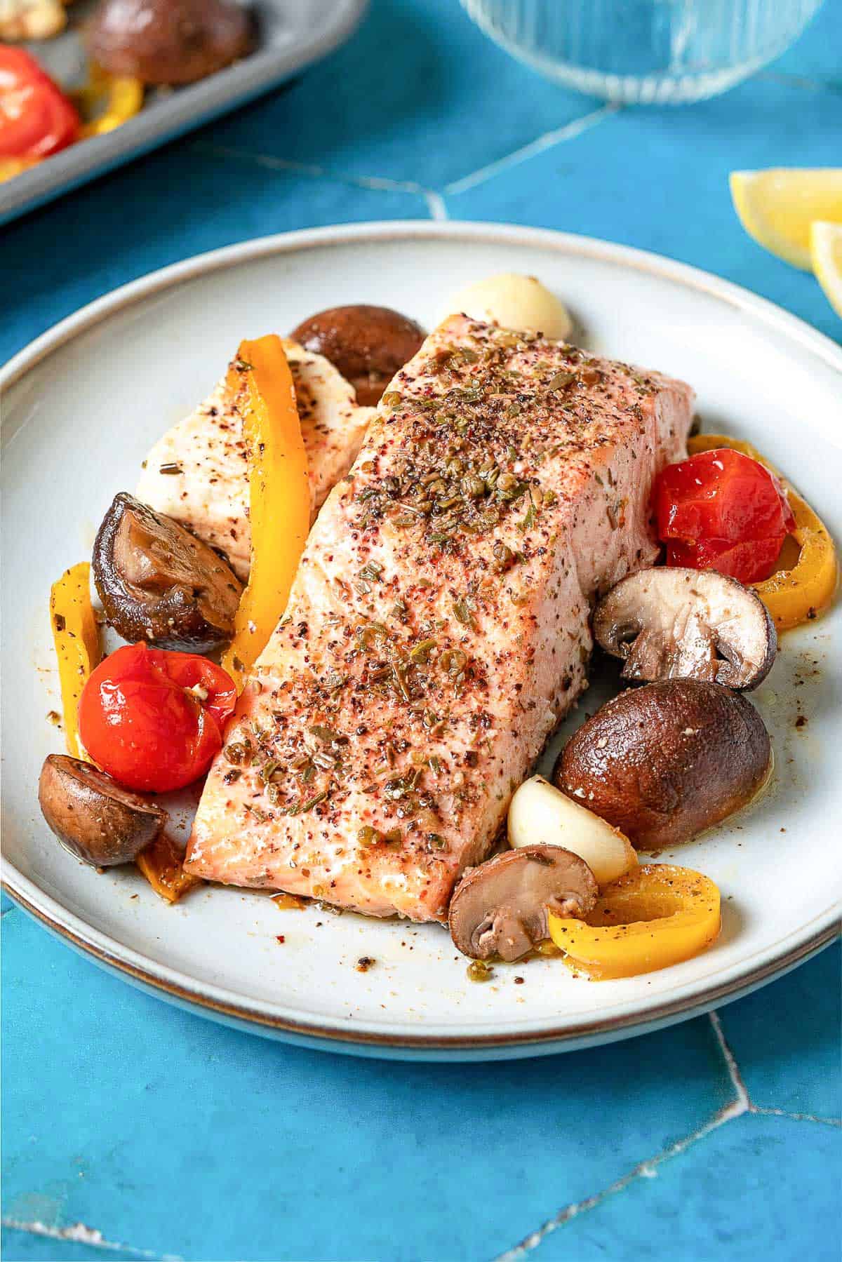 A serving of the mediterranean salmon recipe on a plate.