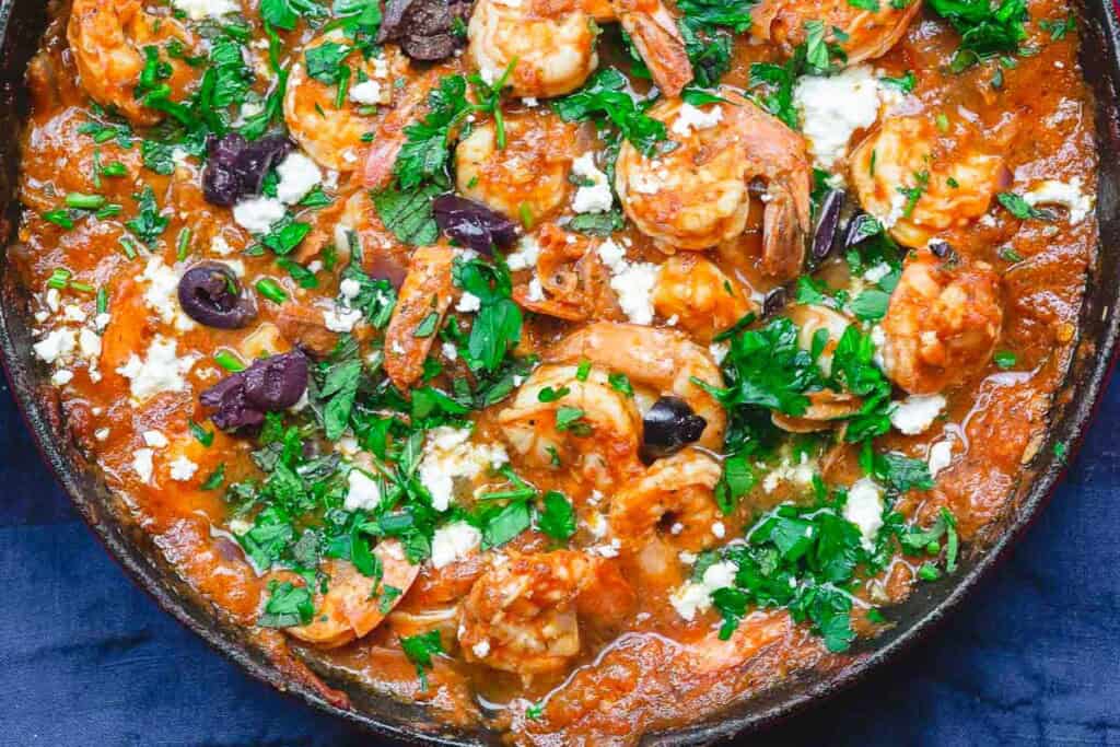 An overhead photo of Greek shrimp in a skillet.