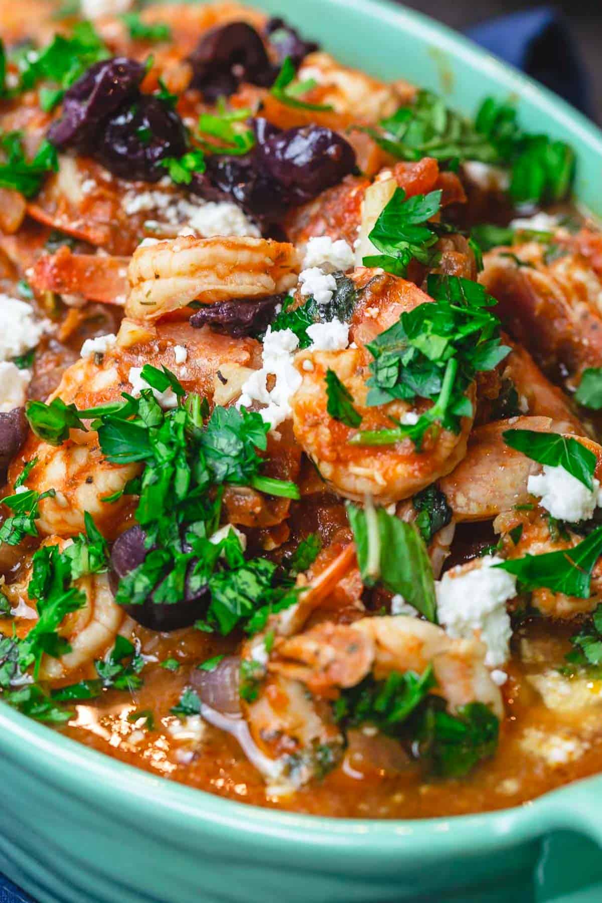 A close up of shrimp saganaki in a serving bowl.