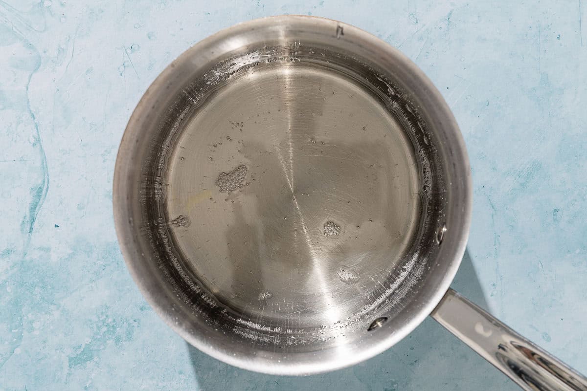 The syrup for the alfajores in a saucepan.