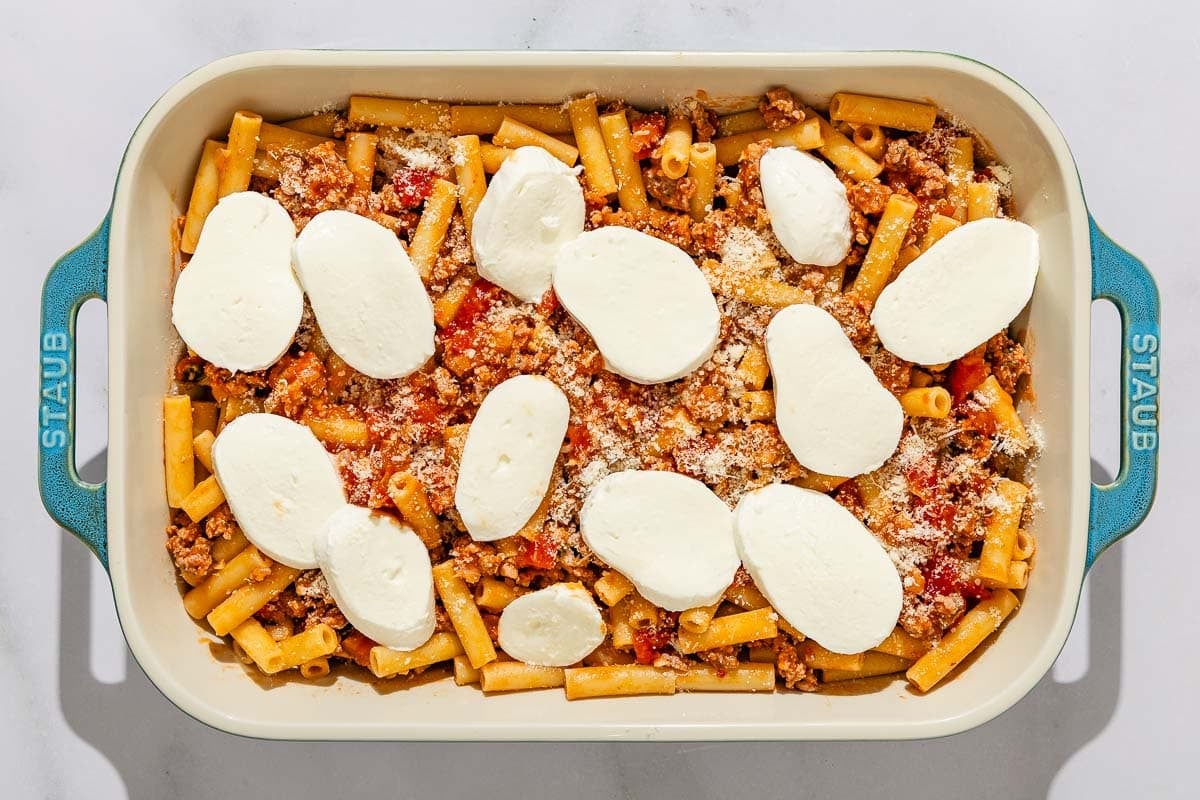 The baked ziti in a baking dish just before being placed in the oven.