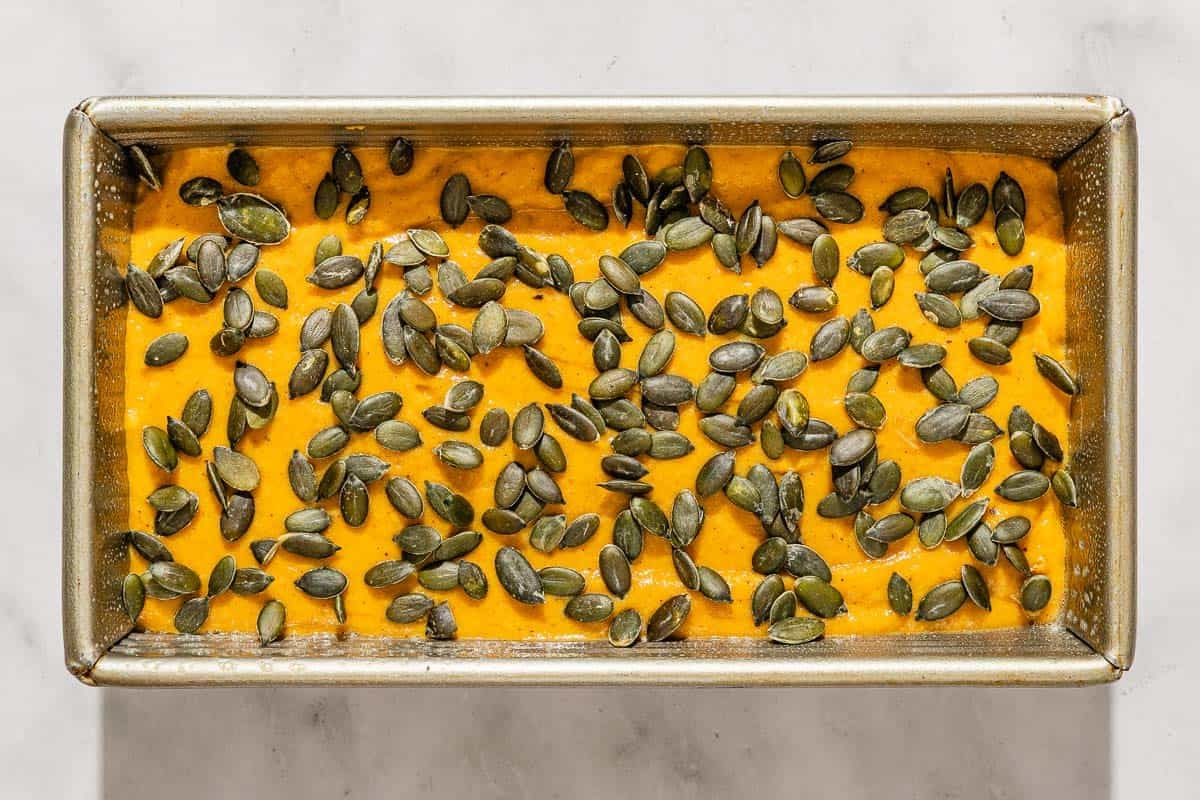 An overhead photo of the unbaked pumpkin bread in a loaf pan.