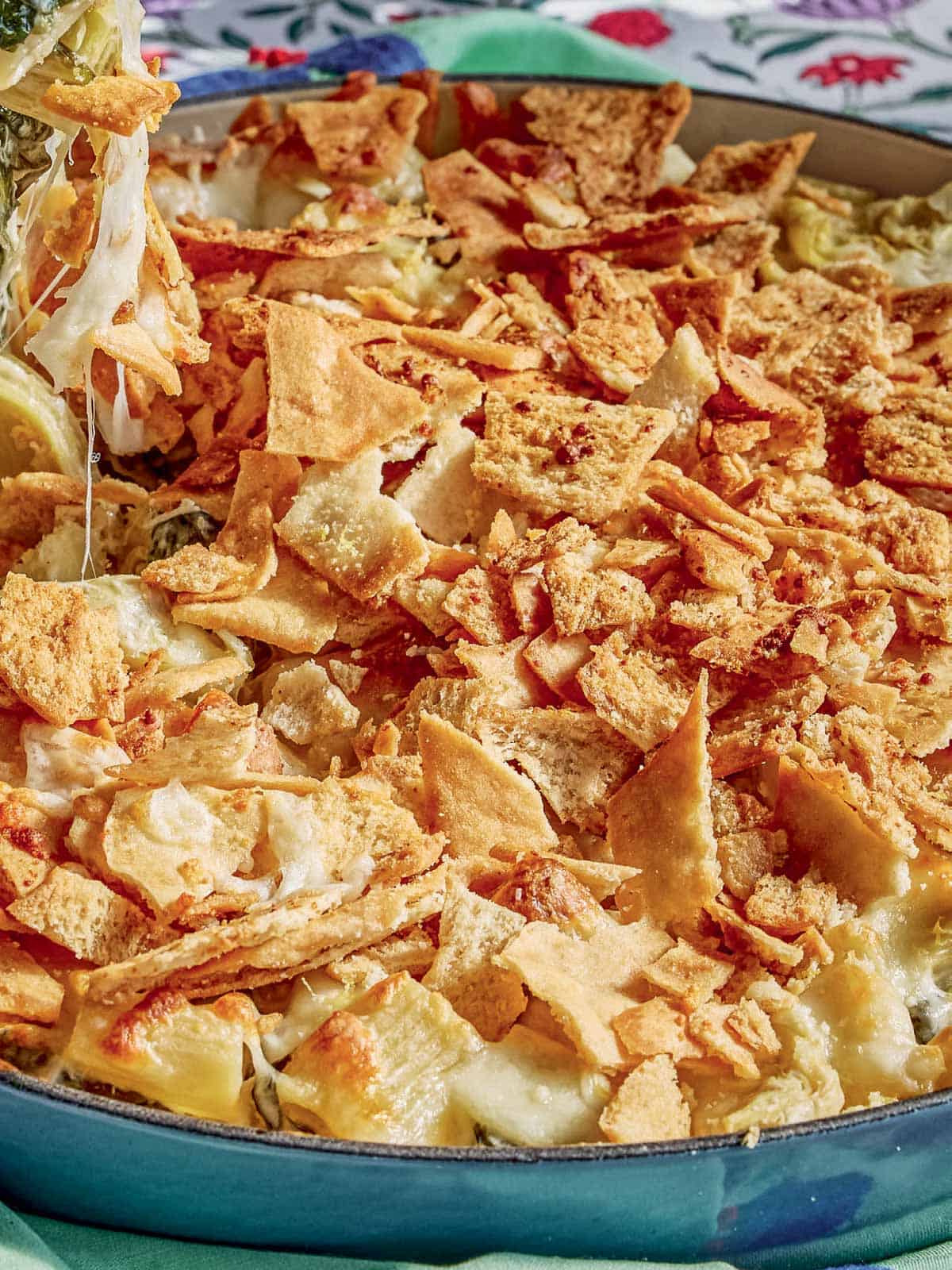 A close up of the spinach artichoke pasta in a skillet.
