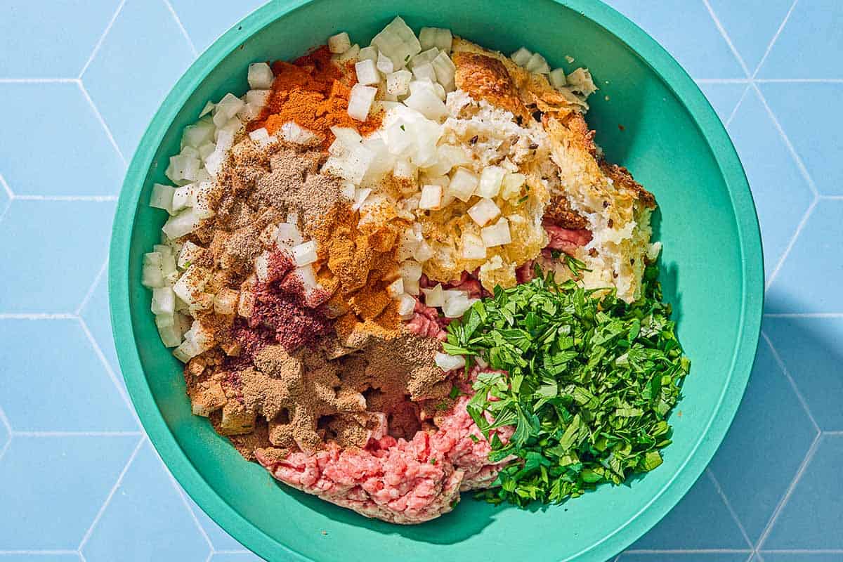The ingredients for the sheet pan baked kofta in a bowl just before being mixed together.