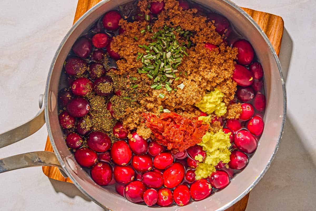 The ingredients for the cranberry mint chutney in a saucepan before being mixed together and simmered.