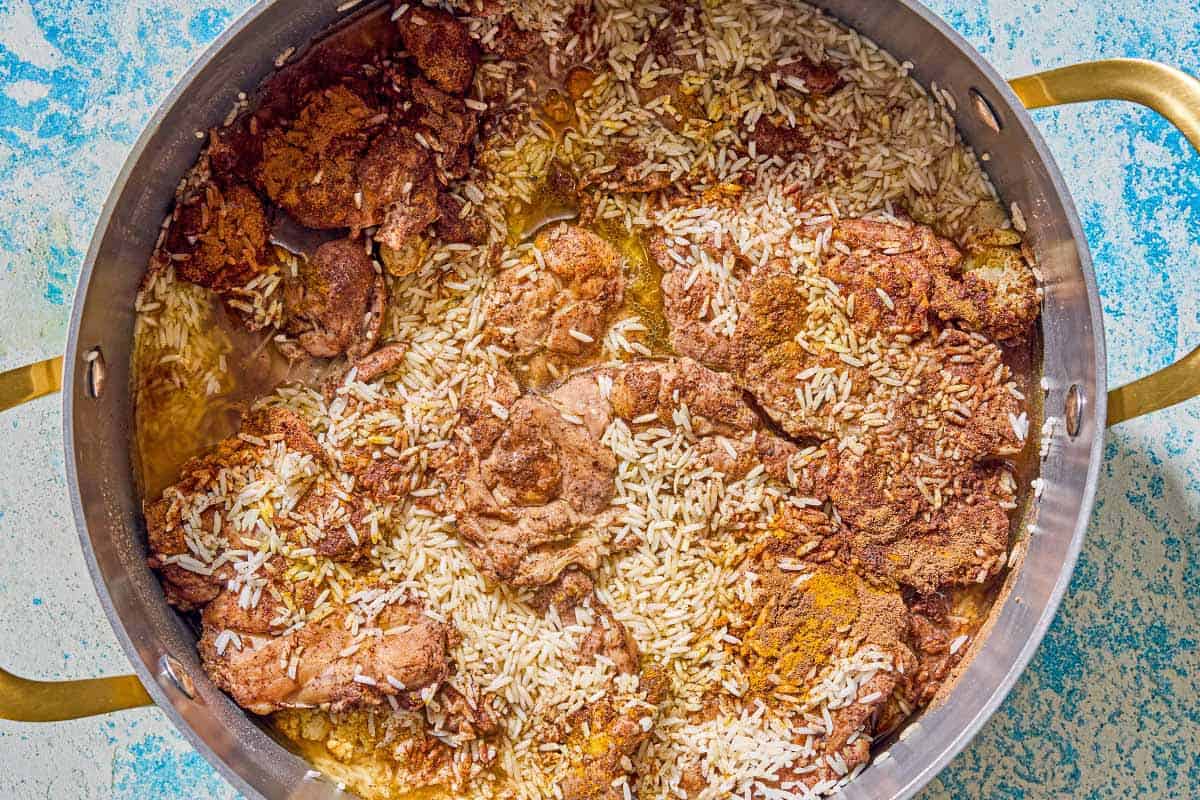 The maqluba being cooked in a large pot.