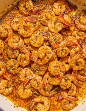 Sautéed shrimp in a skillet.