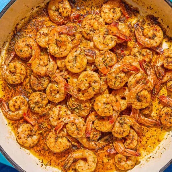 Sautéed shrimp in a skillet.