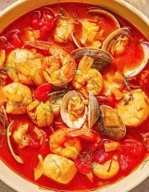 A serving of bouillabaisse in a bowl.