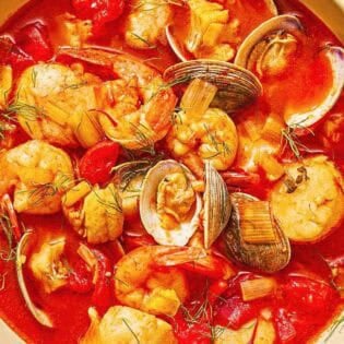 A serving of bouillabaisse in a bowl.