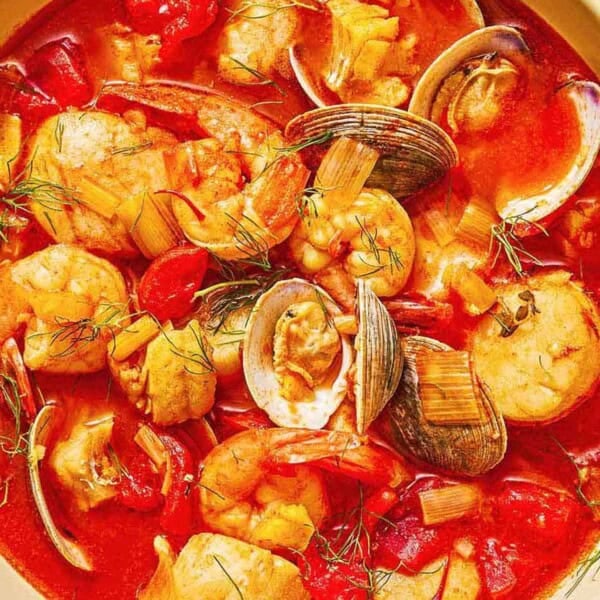A serving of bouillabaisse in a bowl.