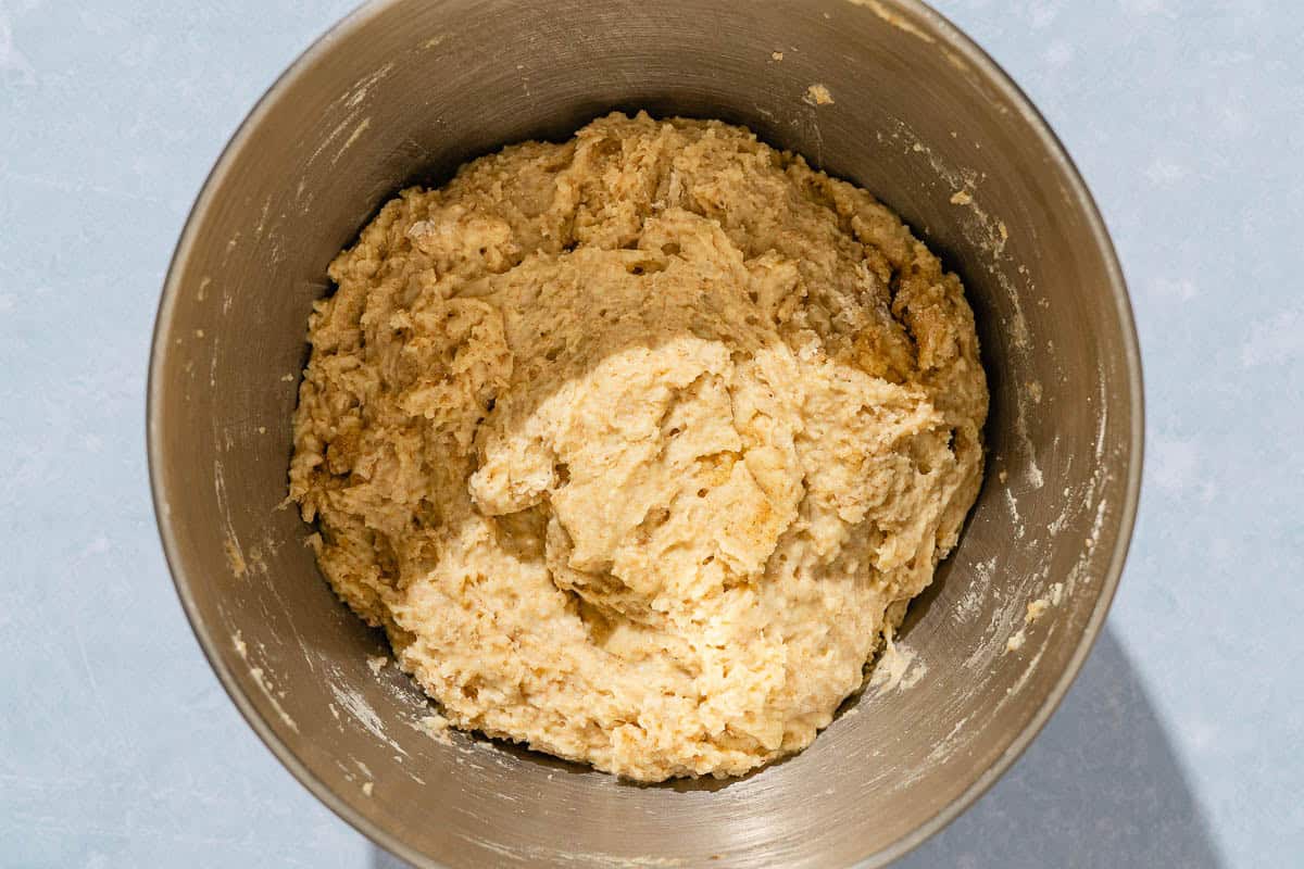 The kneaded dough for the dinner rolls in a bowl.