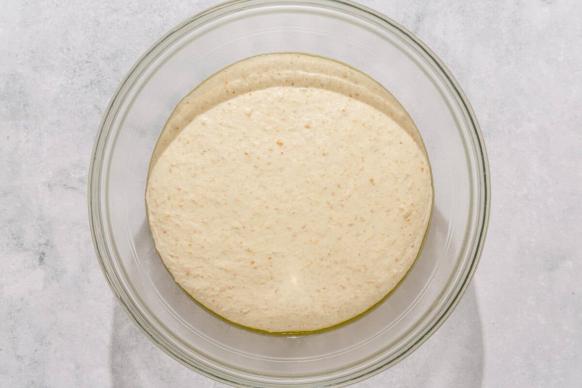 The dough for the fougasse rising in a bowl.