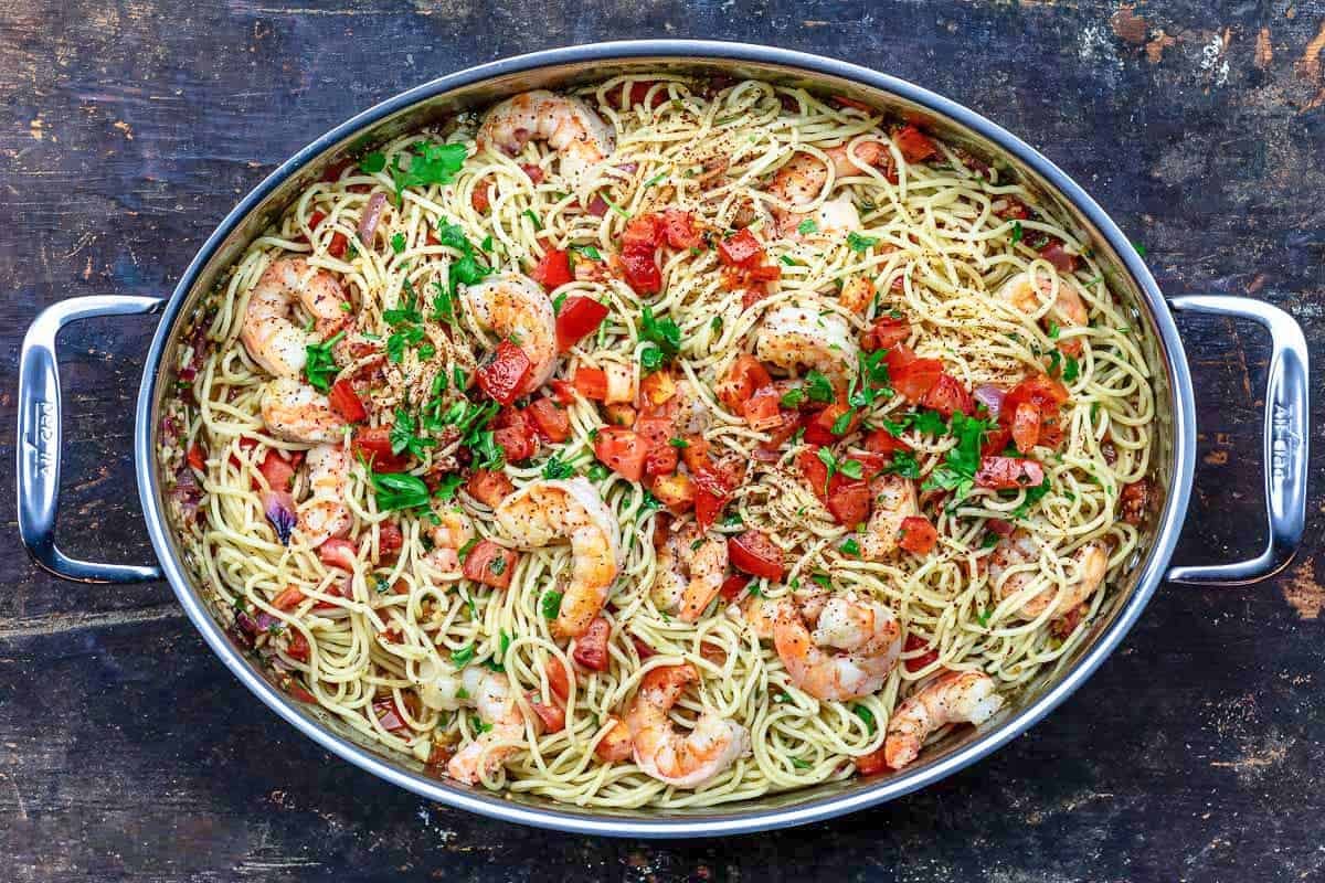 Shrimp pasta in a deep sided skillet.