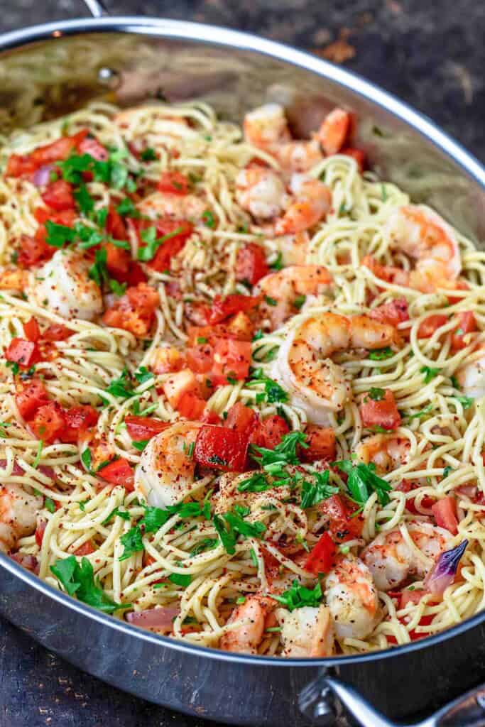 Shrimp pasta in a deep sided skillet.