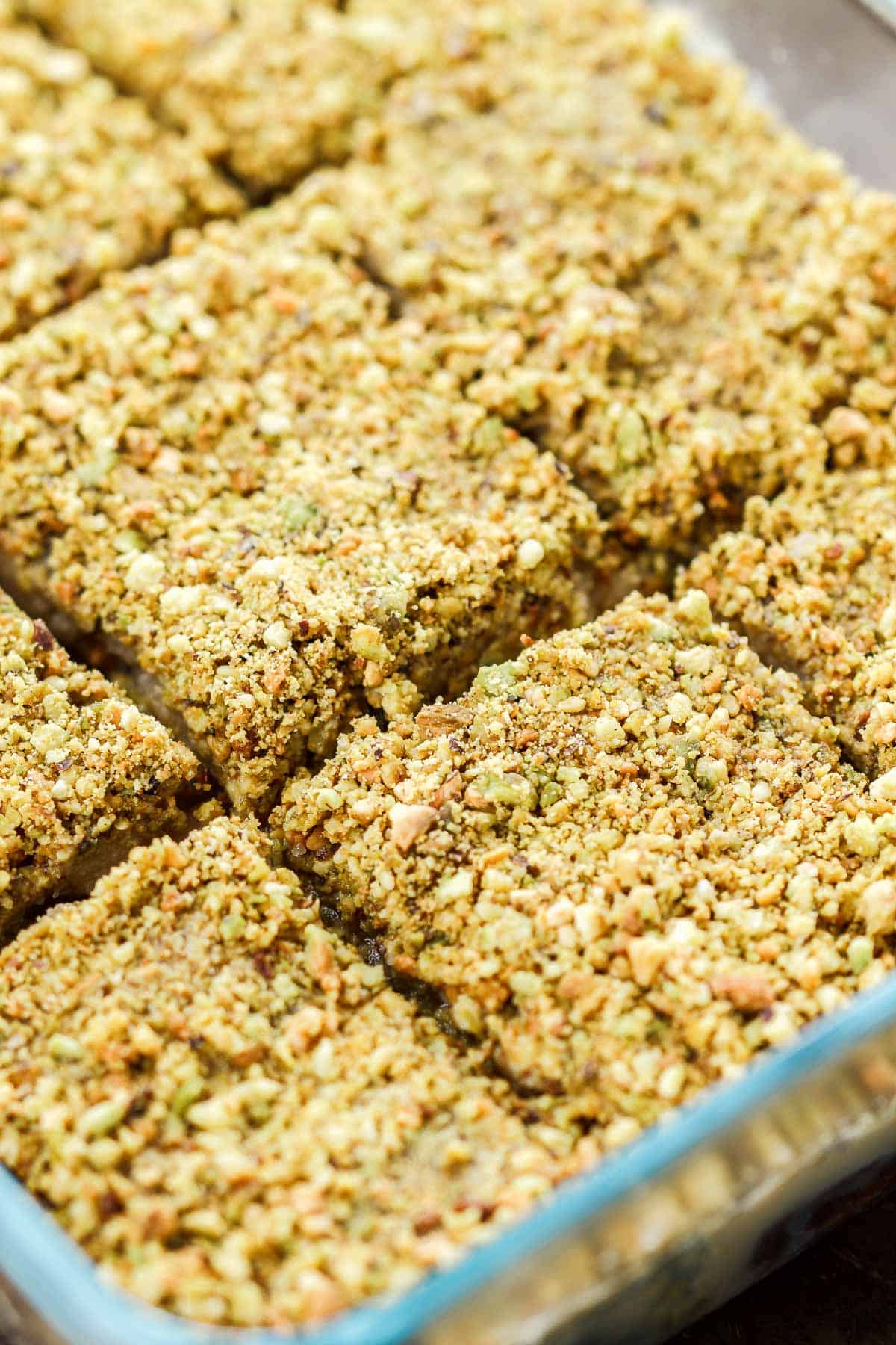 A close up of several no bake dessert bars in a baking dish.