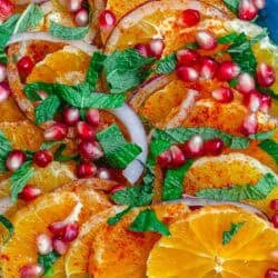 A close up of the pomegranate salad on a platter.