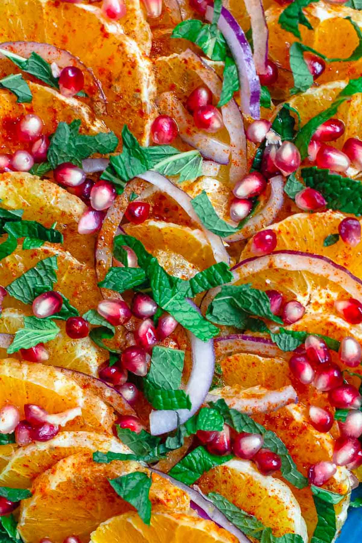 A close up of the pomegranate salad on a platter.