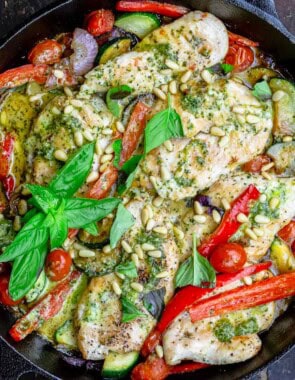 An overhead photo of the pesto chicken recipe in a cast iron skillet.