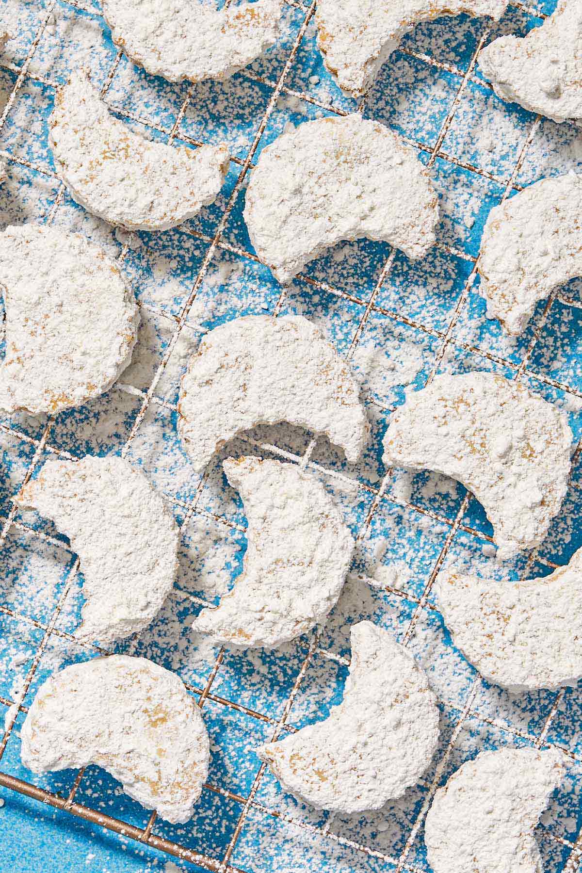 Almond cookies on a wire rack.