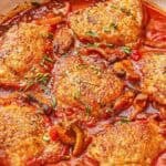A close up of chicken chasseur in a skillet.