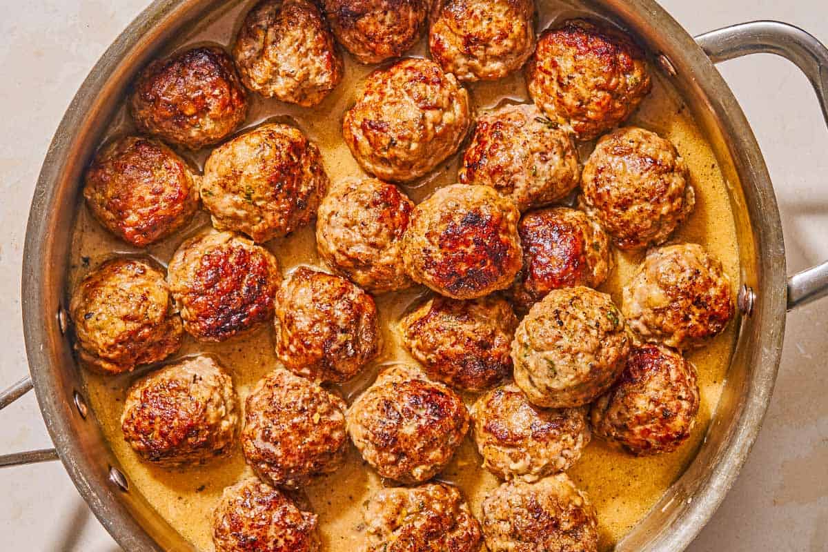 Greek meatballs in a skillet.