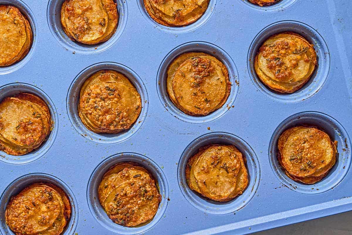 Potato stacks in a muffin tin.