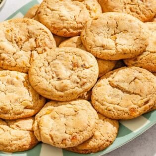 Several apricot cookies on a platter.