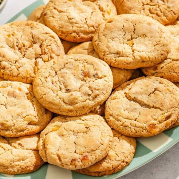 Several apricot cookies on a platter.