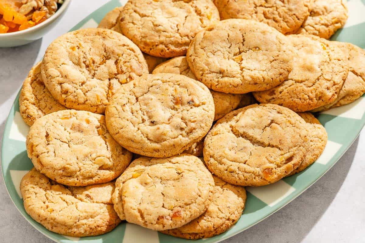 Several apricot cookies on a platter.