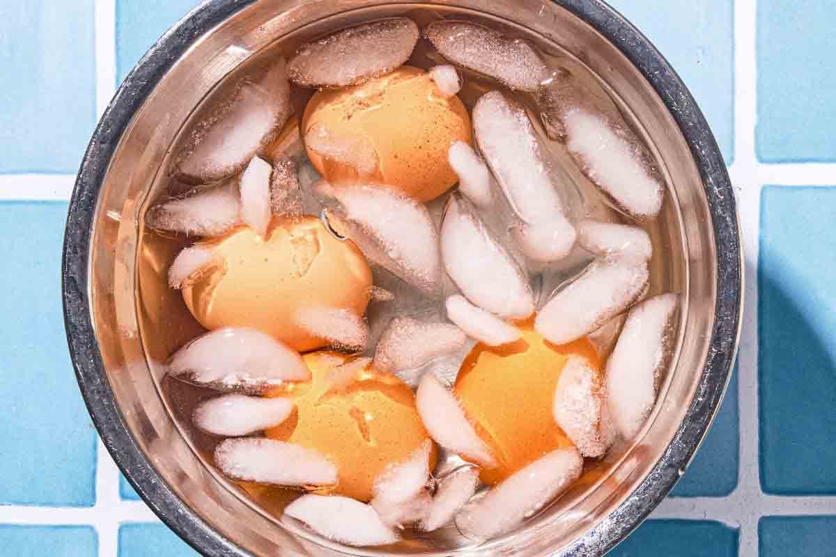 The eggs in a bowl of ice water.
