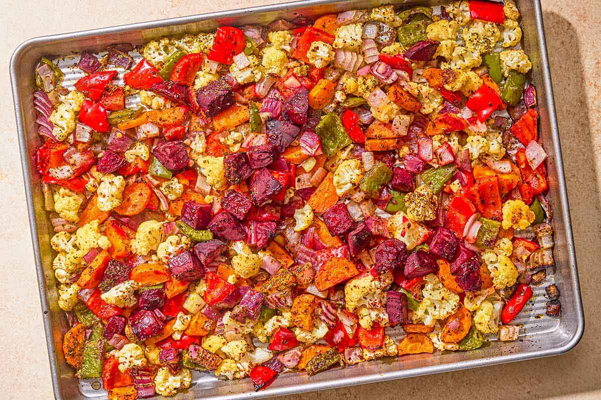 Oven roasted vegetables on a sheet pan.